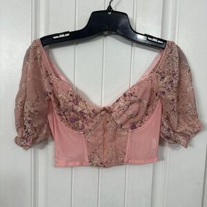 Pink floral corset top with sheer sleeves. Size Medium.
